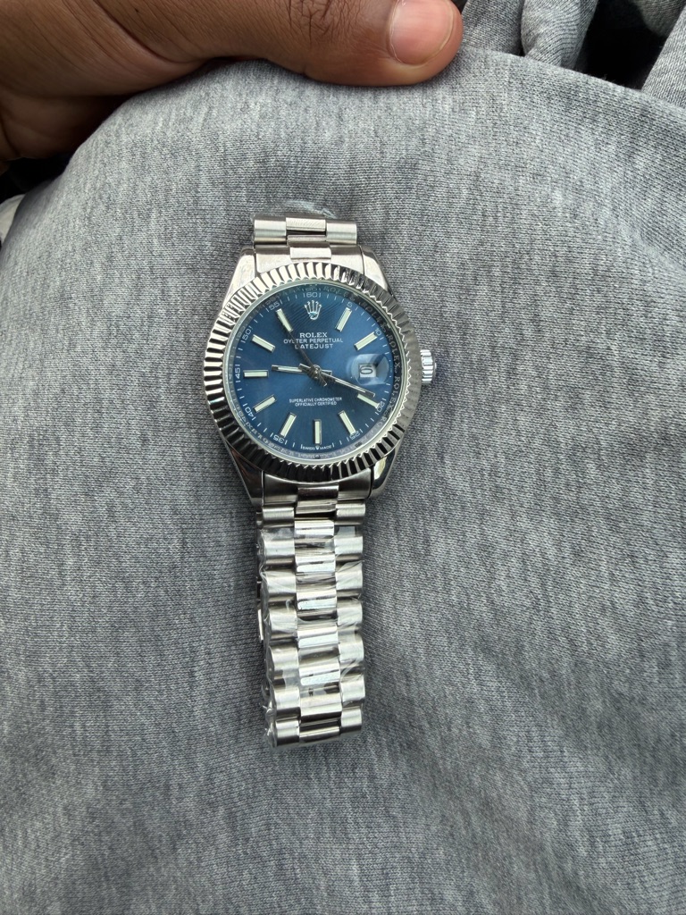 rolex steel watch with blue dial and silver bracelet